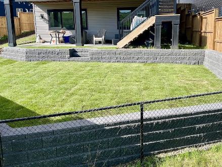 Tiered Retaining Wall in a sloped backyard in Cochrane Alberta