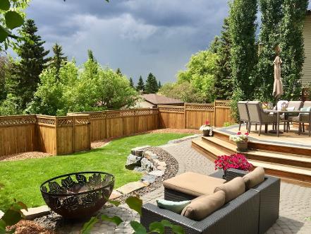 Backyard paving stone seating construction in Calgary backyard