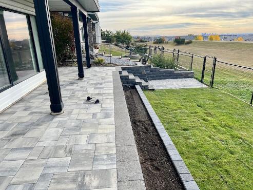 Paving stone installation in Calgary backyard