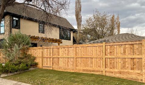 Custom wood fence construction in Calgary backyard