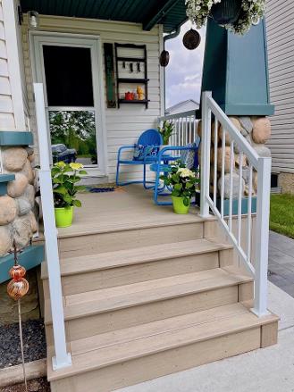 Composite front porch construction in Calgary front yard