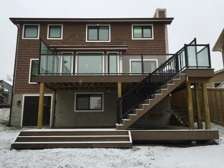 Two level composite deck construction in Calgary backyard