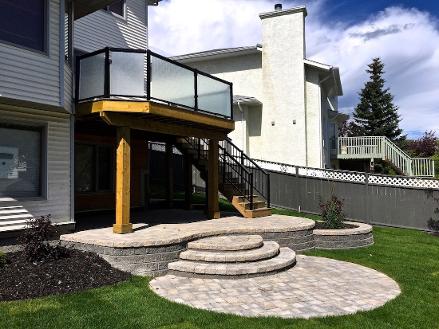 Calgary paving stone patio & deck construction in backyard