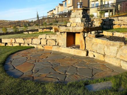 Outdoor fireplace construction in Calgary backyard