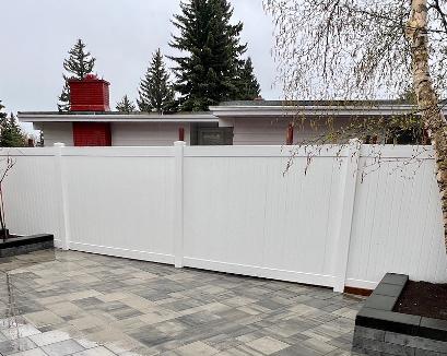 White Vinyl Fence in Calgary Backyard Landscaping