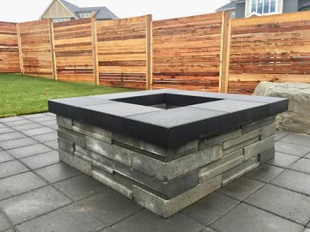 Outdoor Gas fire pit Built by Rundle Landscaping in Calgary Backyard